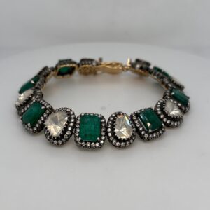 18 Karat Yellow Gold Emerald And Diamond Bracelet. 7 Step Cut Emeralds Total